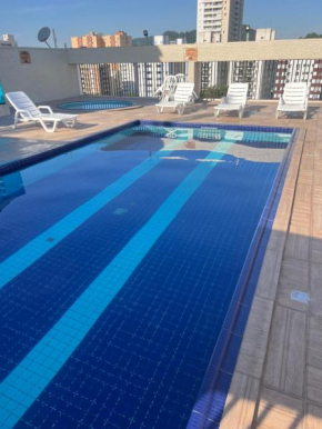 Flat com piscina ao lado da praia